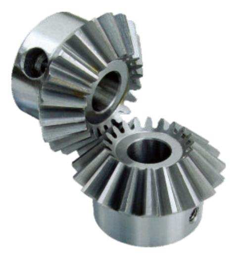 Close-up of metallic bevel gears interlocking and rotating